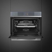 Компактный духовой шкаф с пароваркой Smeg SF4104WVCPS фото 4 в Краснодаре