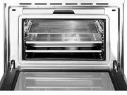 Компактный духовой шкаф с пароваркой Smeg SF4750VCBS фото 3 в Краснодаре
