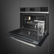 Компактный духовой шкаф с пароваркой Smeg SF4104WVCPN фото 2 в Краснодаре